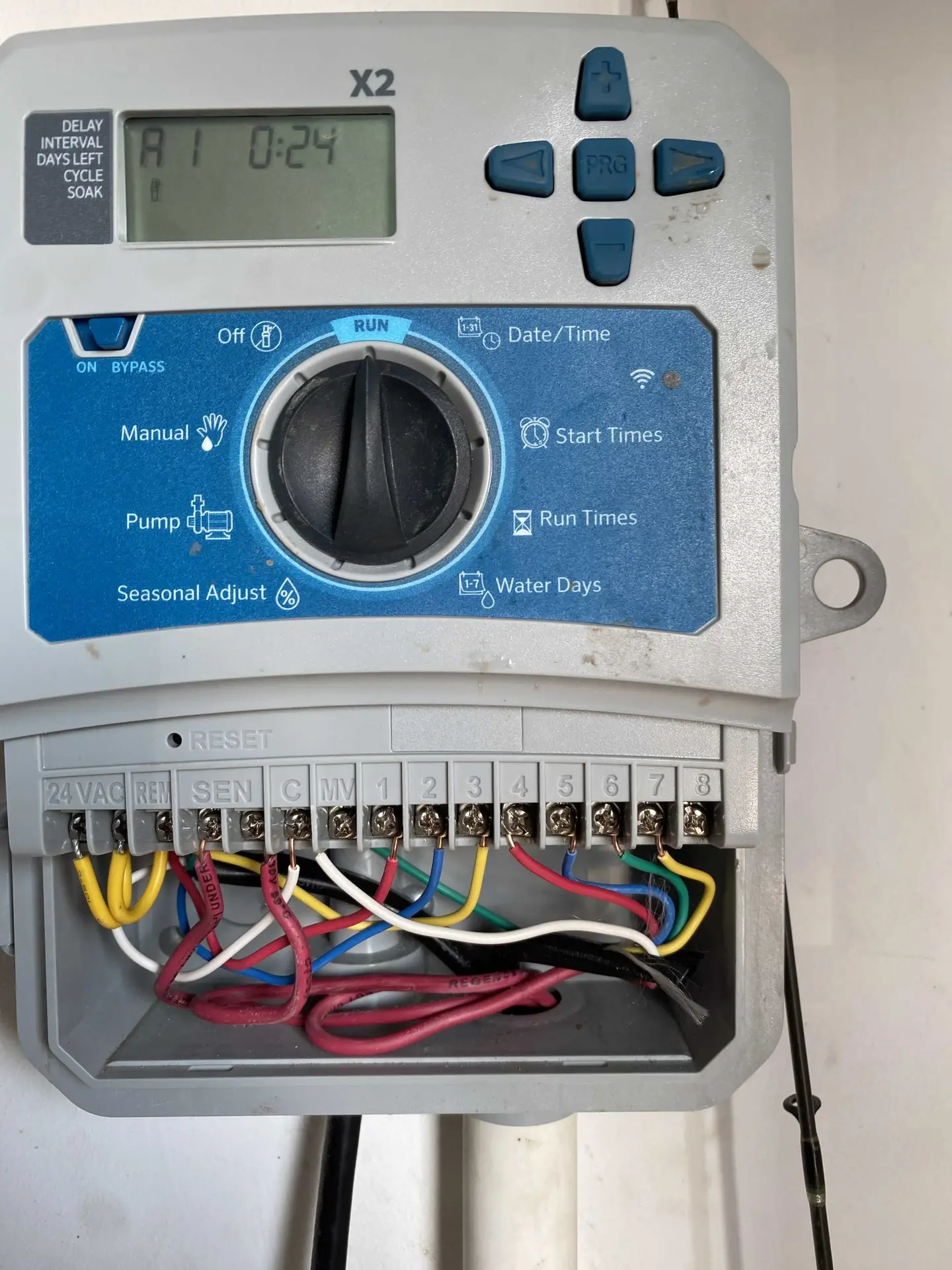 Open irrigation controller with station wiring connected during a timer repair